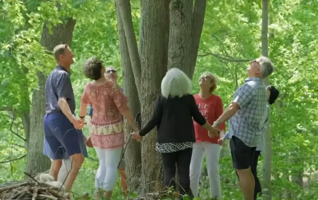 the groves family stands around their memorial tree