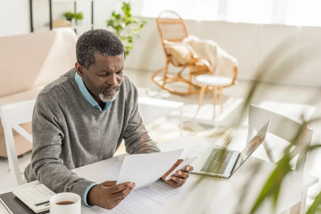 A senior man write a letter of instruction for his loved ones