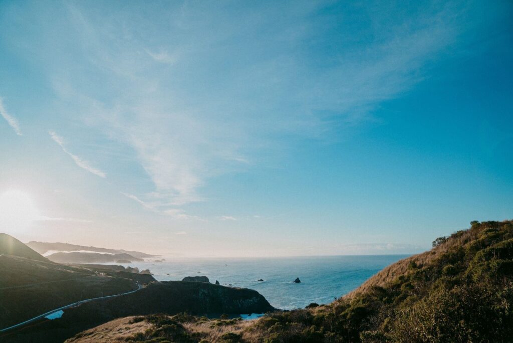 View of California ocean and hills on a sunny day with blue skies