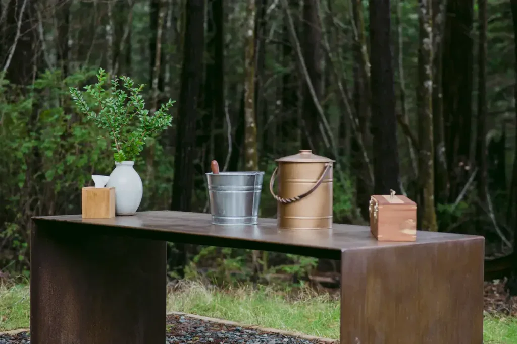An urn used to turn ashes into a tree sits on a memorial table in a Better Place Forests Memorial Forest