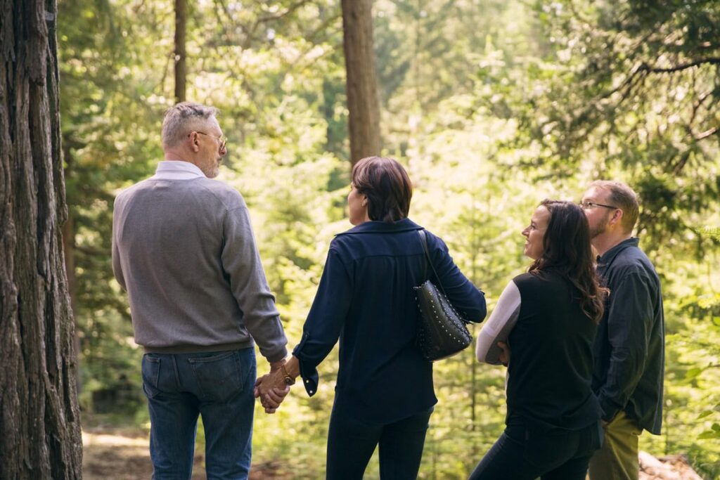 A group in the forest discussing senior resources and programs for the elderly