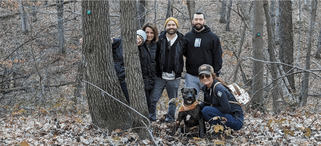 a family by their memorial tree in better place forests St. Croix Valley stay connected to their dad