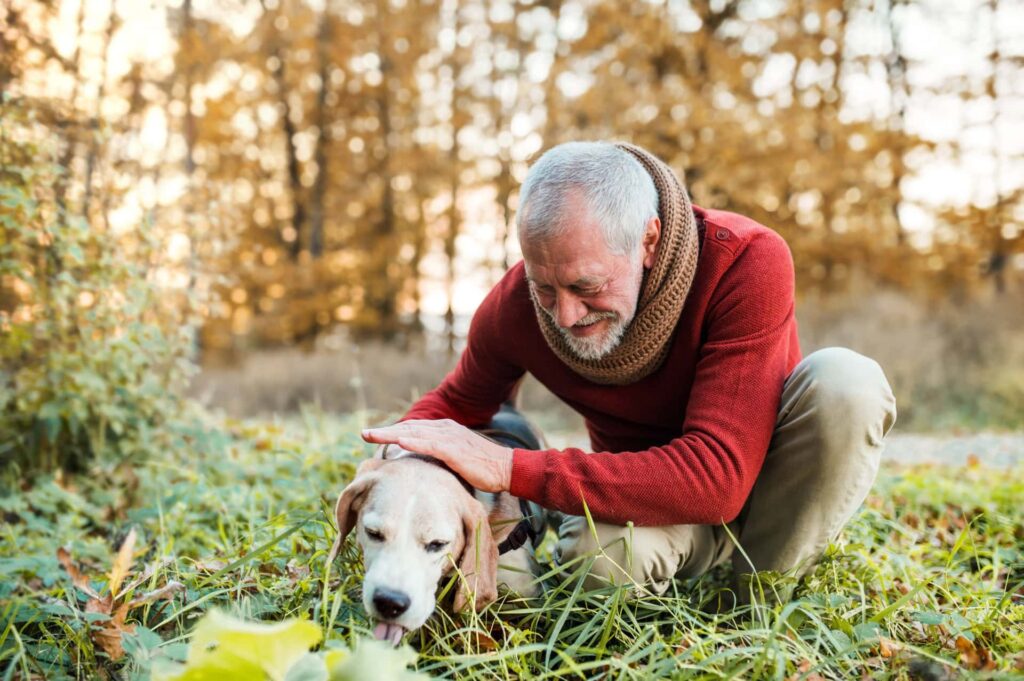 Senior man with older dog
