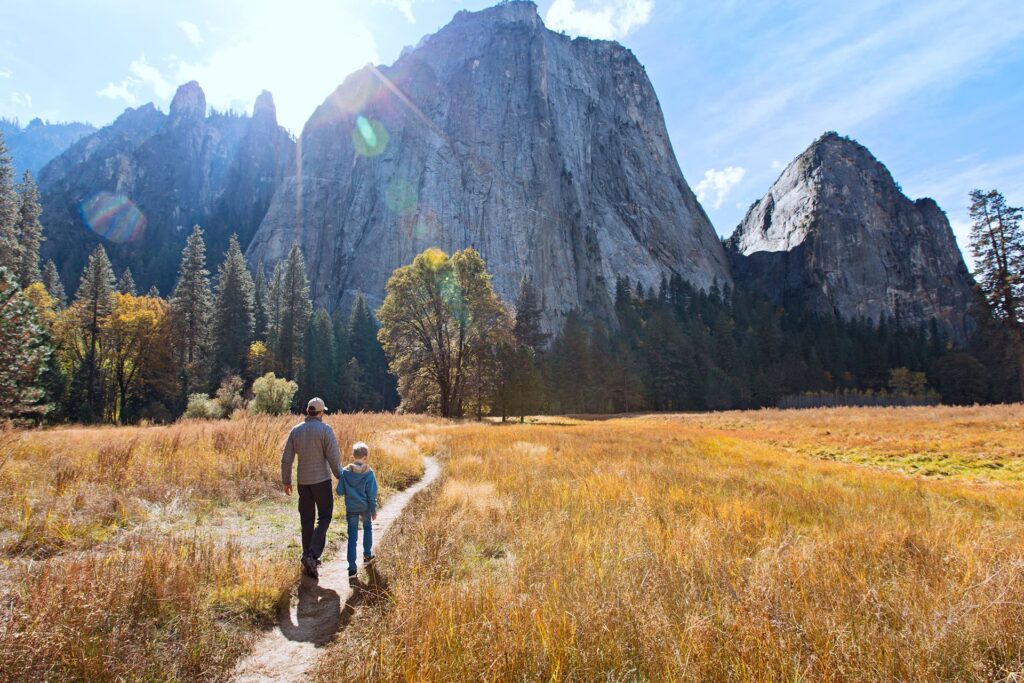 Family hiking on a trail in Yosemite National Park, California
