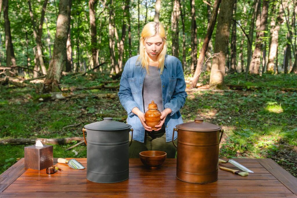 A woman holding an urn with ashes to spread outside