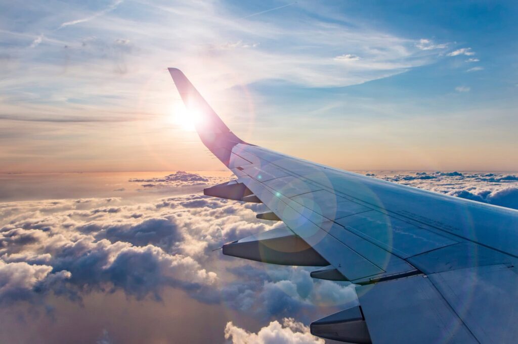 a plane flying over clouds