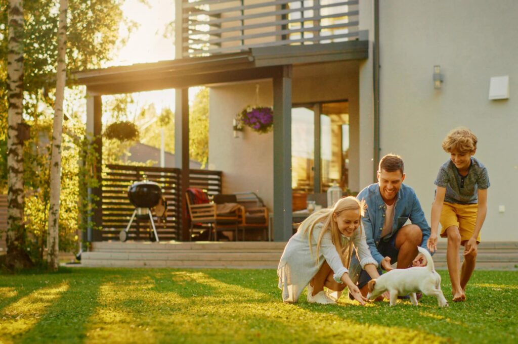 a family with a puppy in their backyard