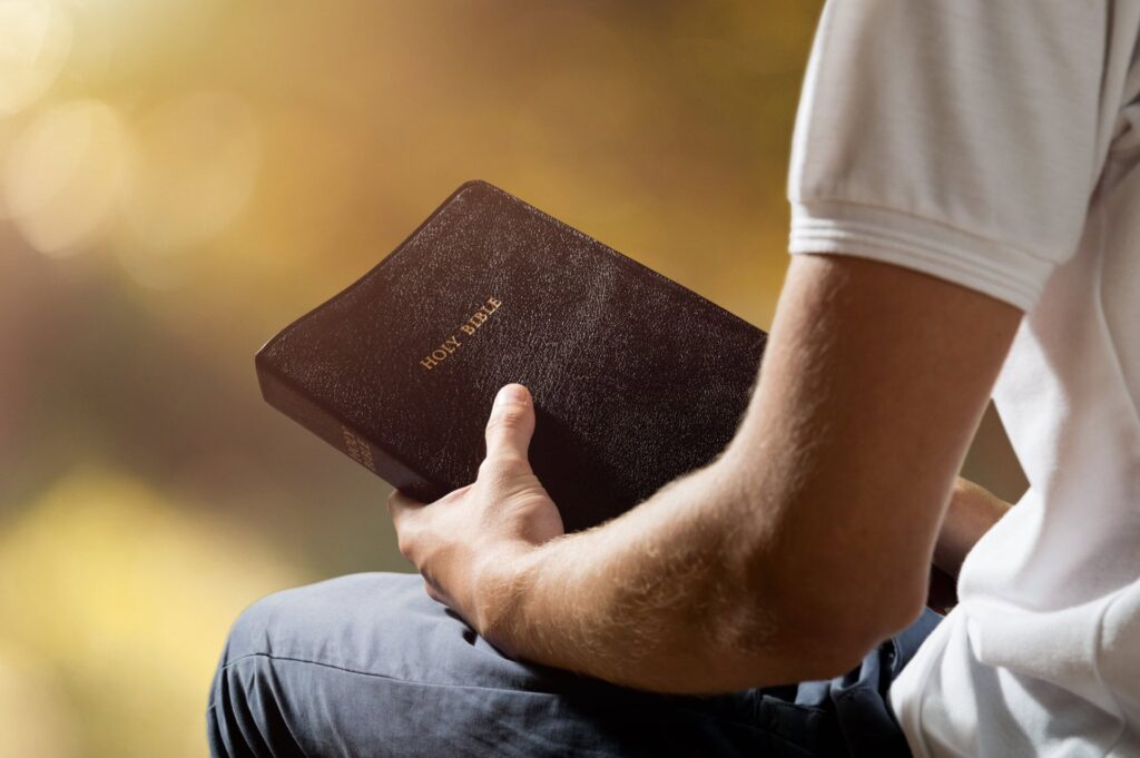 A man holds a bible