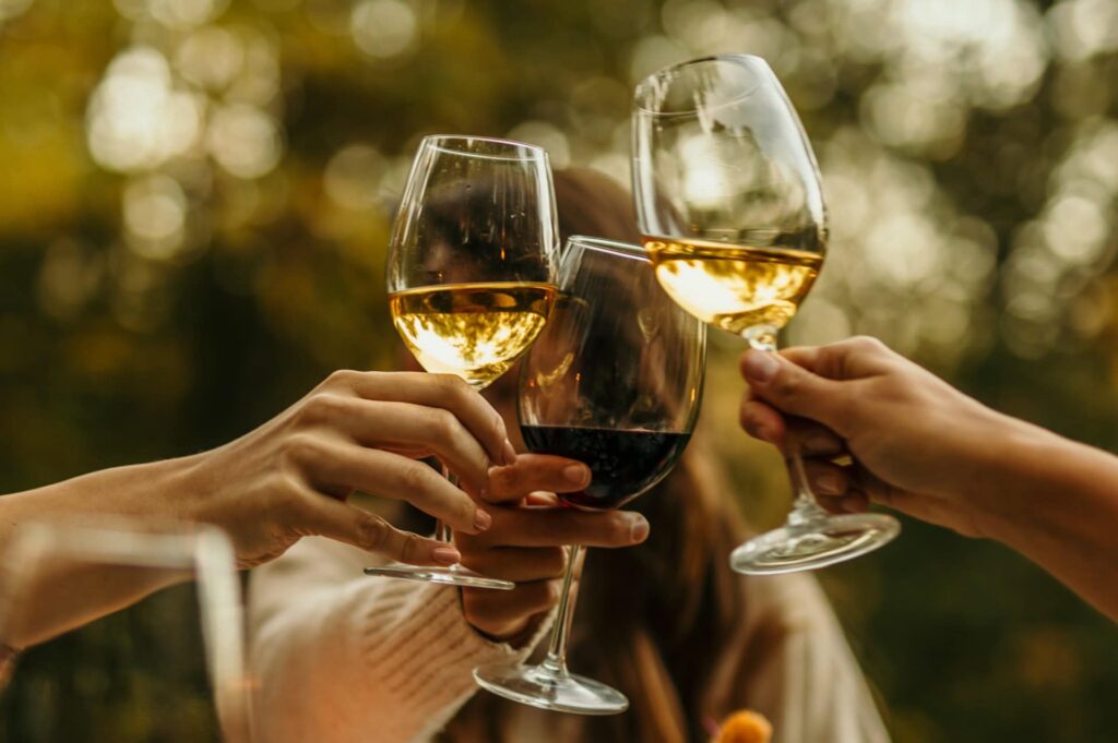 A closeup of a group of people toasting in honor of a deceased loved one