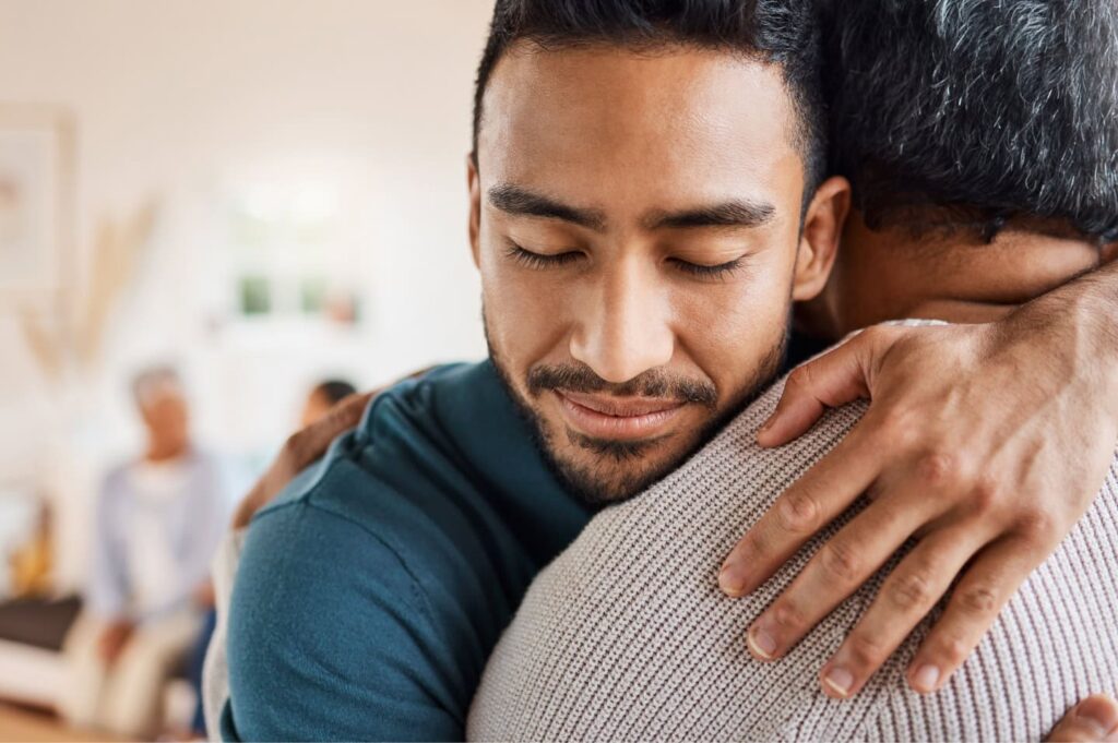 Two people embracing in a comforting hug.